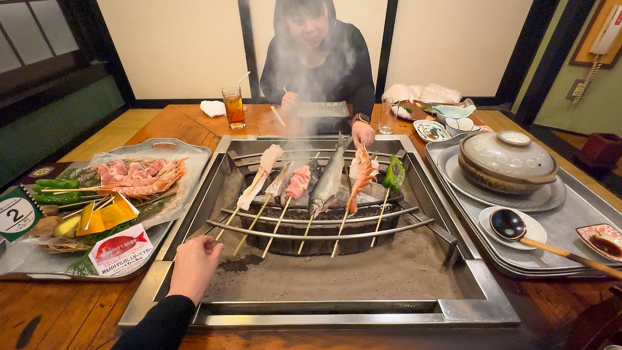 Traditional Japanese Skewer Dining: Unique Floating Tray Experience